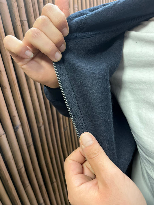 Tuta intera felpata con cappuccio e zip